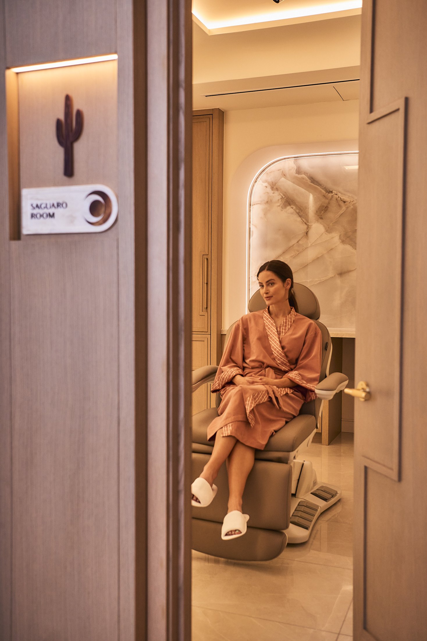 Patient in a robe in the Saguaro treatment room